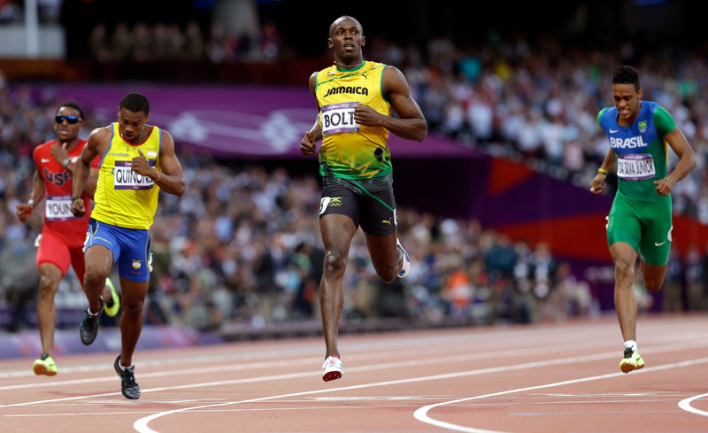 Illustration for article titled Photos Of Usain Bolt Looking Bored As He Blows Past The Best Runners In The World